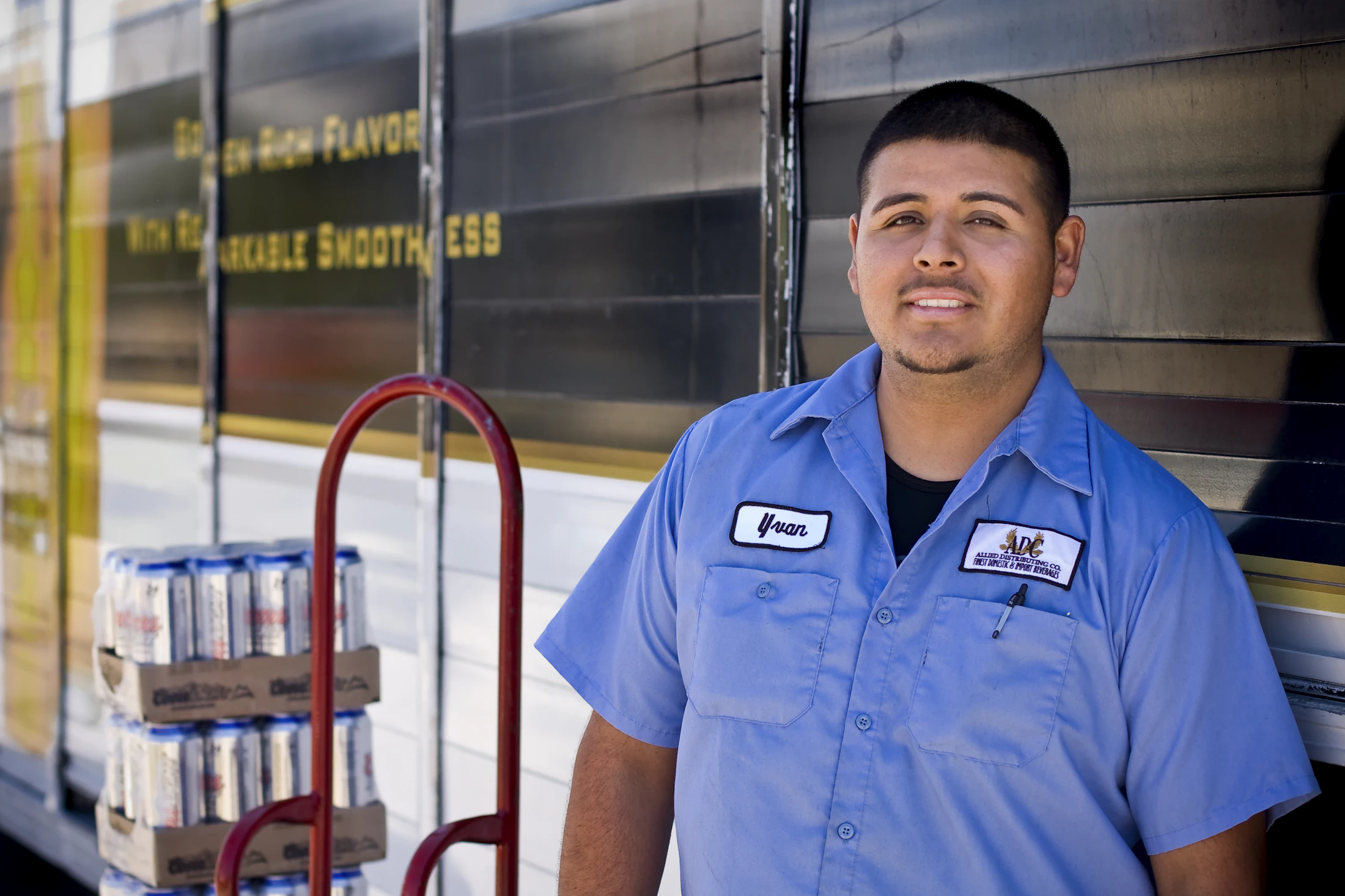 Smiling warehouse worker in a work uniform