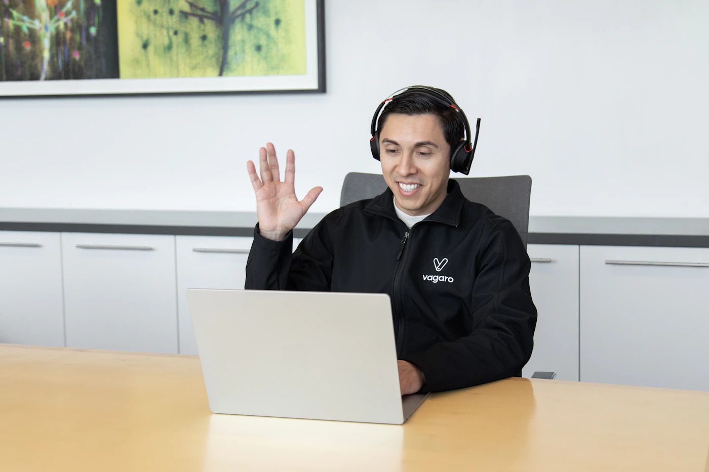 Customer service representative with a headset on a video call